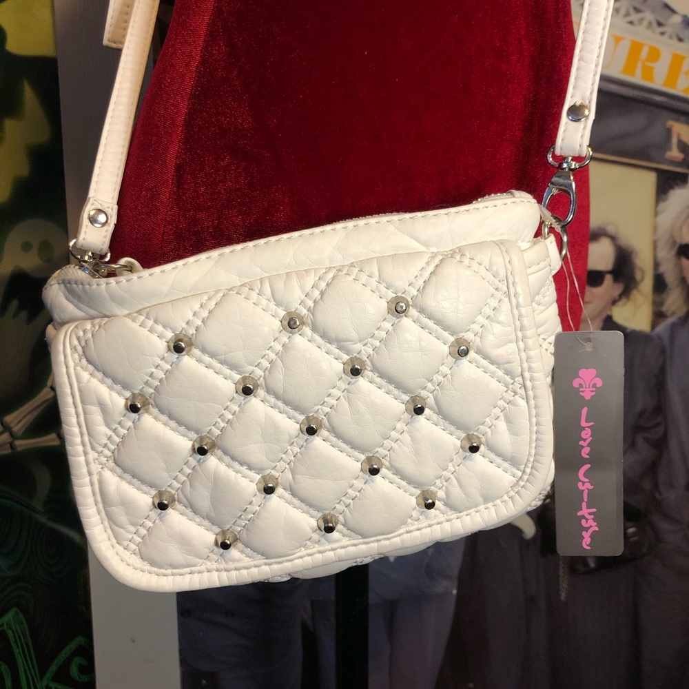 Small faux white leather shoulder purse.